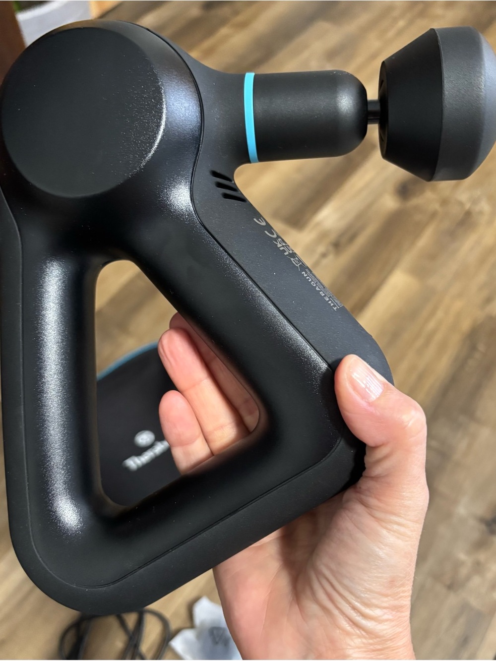 Therabody Black Percussion Massage Gun with Blue Accent